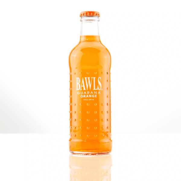 Orange guarana drink in clear bottle