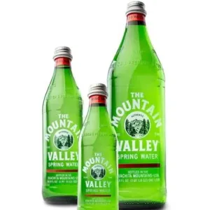 Green glass bottles of spring water