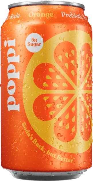 Close-up of a bright orange soda can with a citrus fruit design.