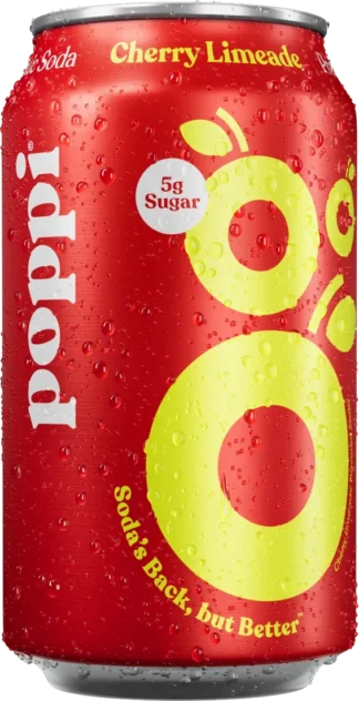Close-up of a red soda can with yellow circles and 5g sugar label.
